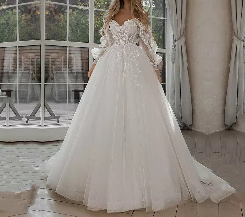 Vestidos de novia bohemios con mangas abullonadas y hombros descubiertos