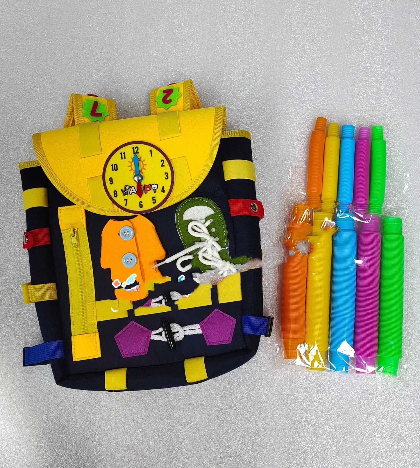 Sac à dos avec boucles et jouets d'activité d'apprentissage pour les tout-petits développent des compétences de base