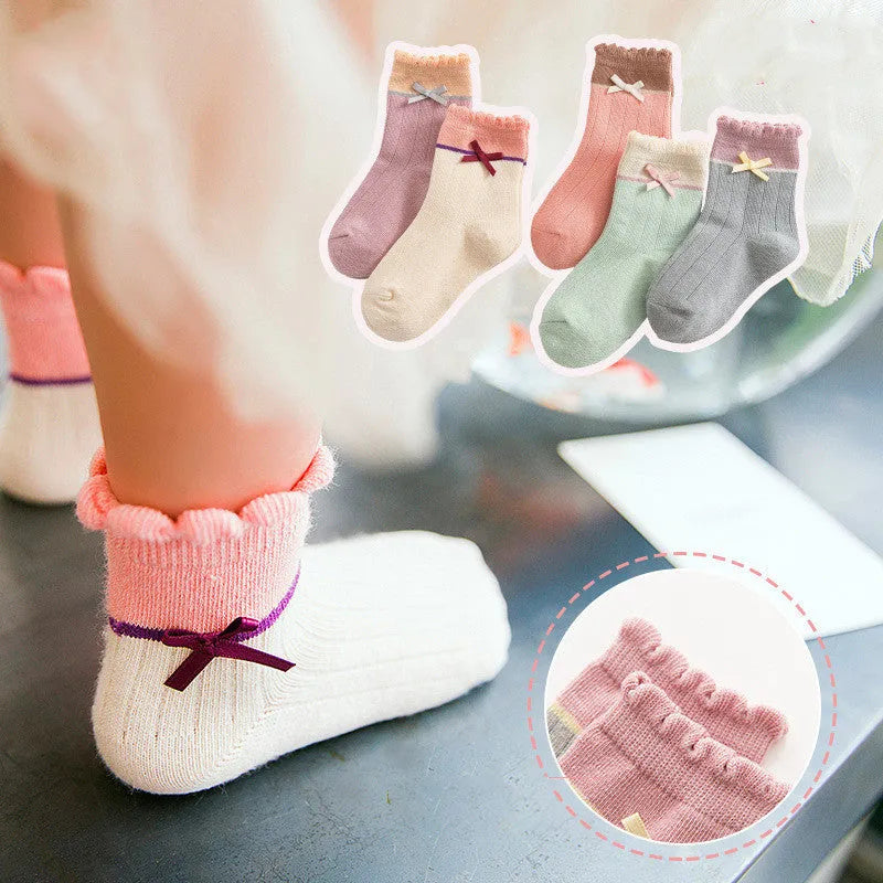 Los calcetines de los niños de los nuevos productos peinaron el arco del algodón