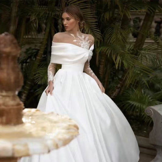 Vestido de novia de satén con falda tutú blanca y mangas largas de raglán