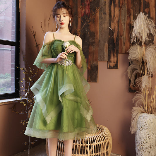 Examen de arte del Guzheng del vestido de novia verde en solitario